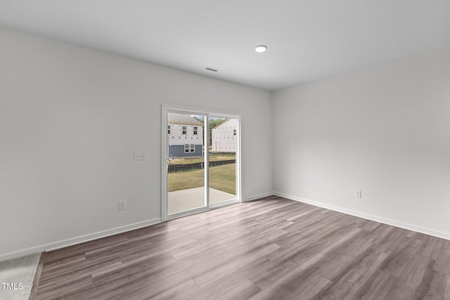 spare room featuring hardwood / wood-style flooring