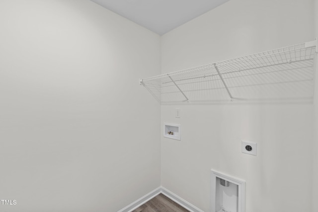 clothes washing area with hardwood / wood-style flooring, washer hookup, and hookup for an electric dryer