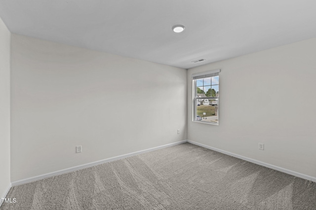 spare room with carpet floors