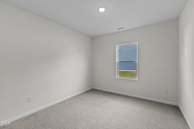 spare room featuring carpet floors