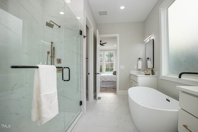 bathroom featuring ceiling fan, vanity, and plus walk in shower