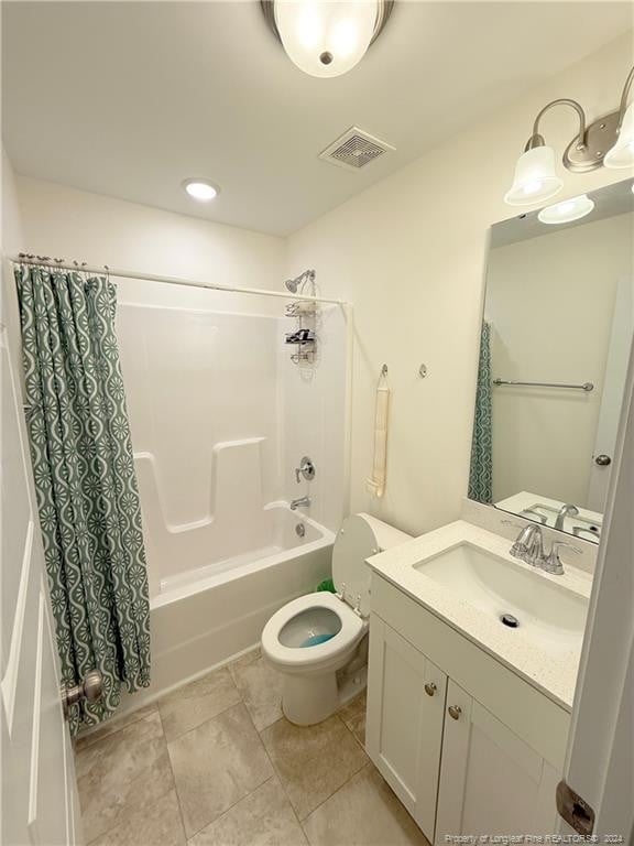 full bathroom with shower / tub combo, vanity, and toilet