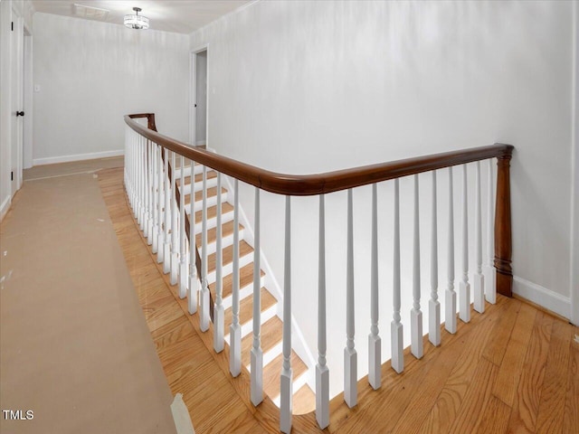 stairs featuring wood-type flooring