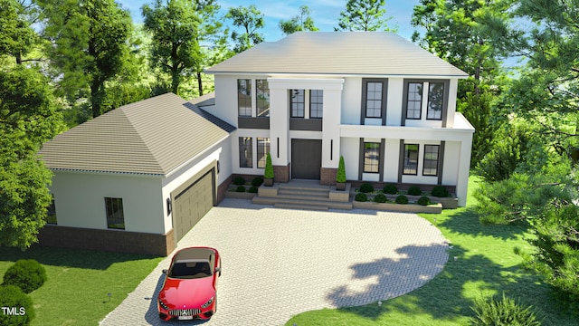 view of front facade featuring a front yard and a garage