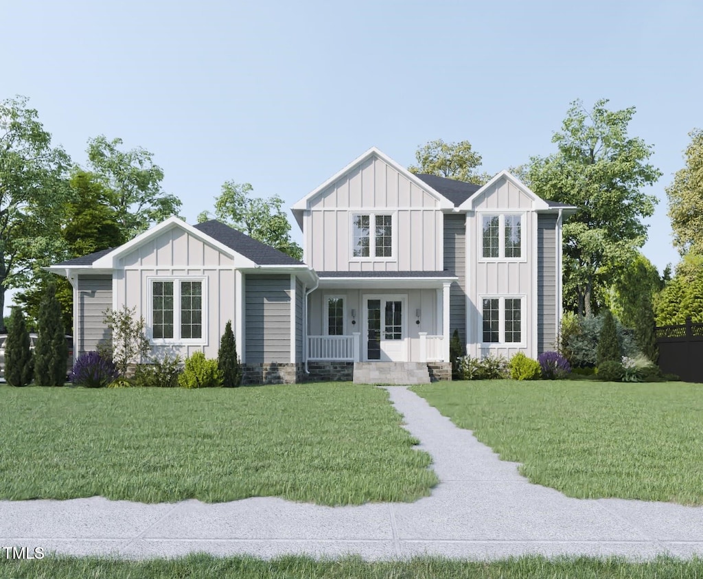 view of front of home with a front yard and covered porch