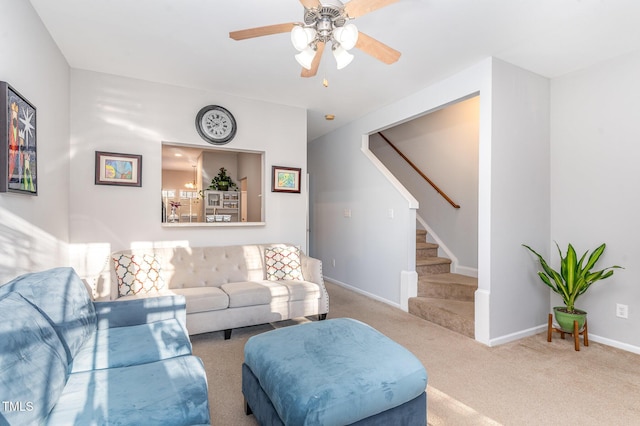 carpeted living room with ceiling fan