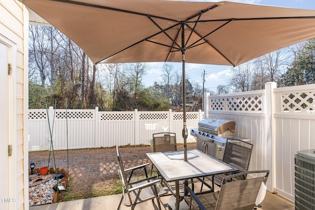 view of patio with a grill