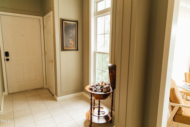 hallway featuring light tile patterned floors