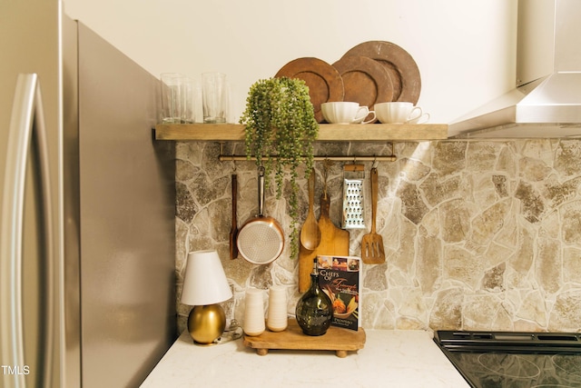 room details with stainless steel fridge and extractor fan