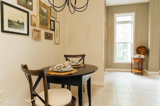 tiled dining room with a healthy amount of sunlight