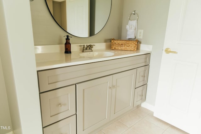 bathroom with tile patterned flooring and vanity