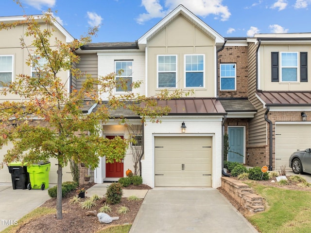 townhome / multi-family property featuring a garage