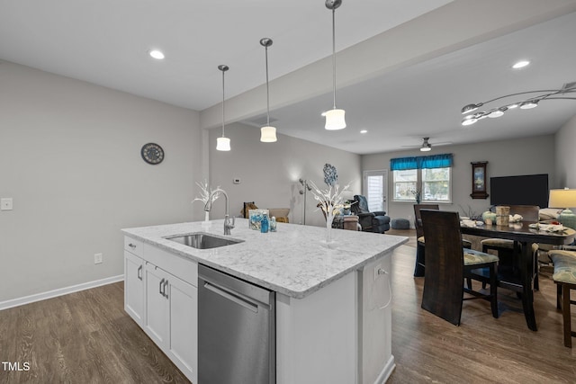 kitchen featuring a center island with sink, decorative light fixtures, dishwasher, white cabinets, and sink