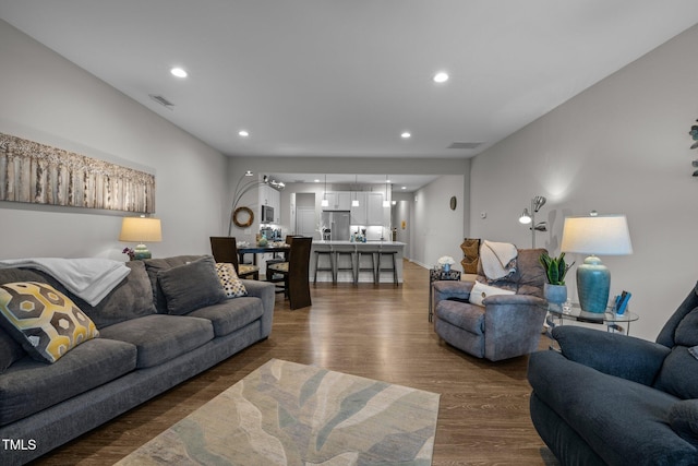 living room featuring dark wood-type flooring