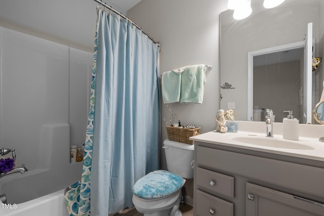 full bathroom featuring toilet, vanity, and shower / tub combo