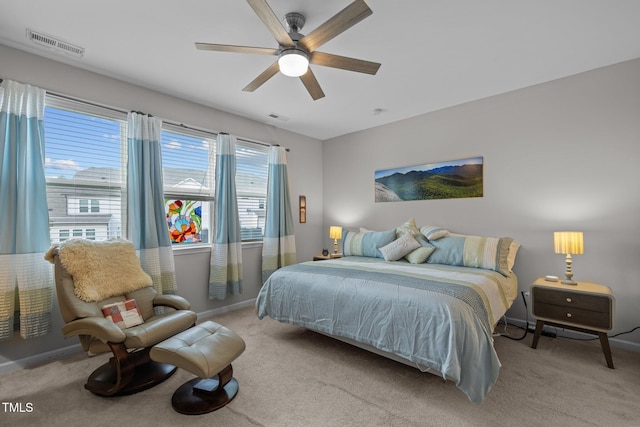 bedroom featuring ceiling fan and light carpet