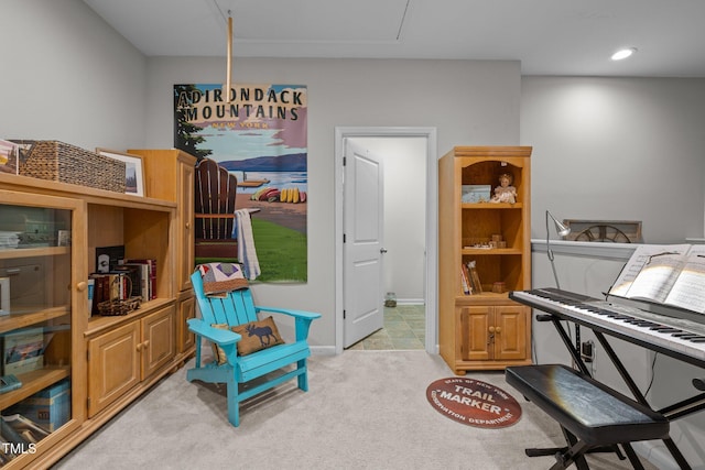 living area with light colored carpet