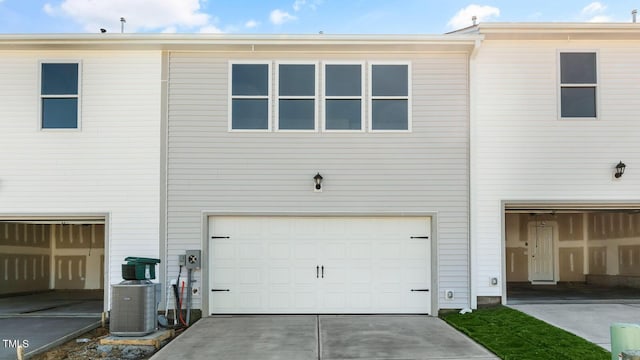 back of property featuring a garage