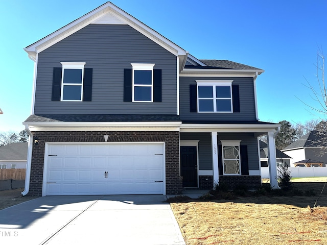 front facade with a garage and a front lawn