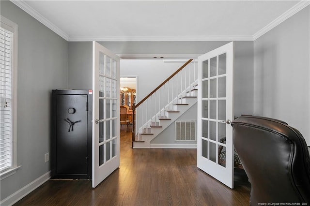 interior space featuring french doors, dark wood-type flooring, and ornamental molding