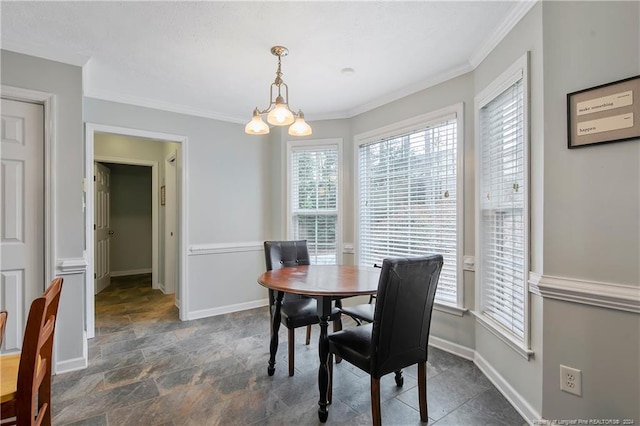 dining area with a notable chandelier and ornamental molding