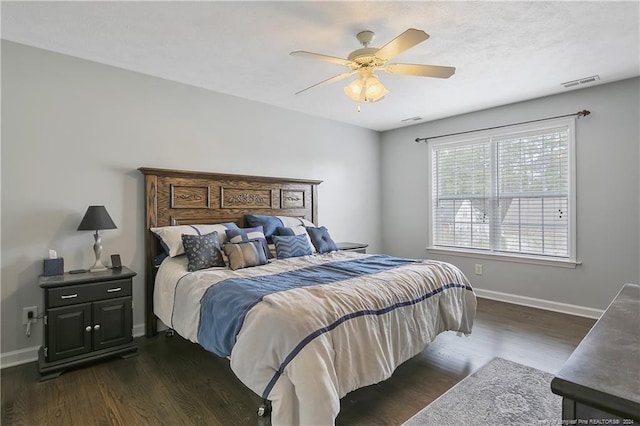 bedroom featuring ceiling fan and dark hardwood / wood-style floors