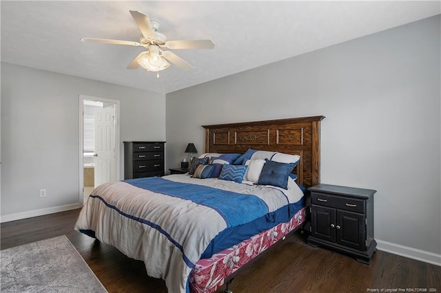 bedroom featuring ensuite bath, ceiling fan, and dark wood-type flooring