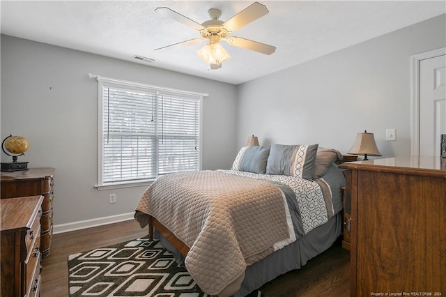 bedroom featuring dark hardwood / wood-style floors and ceiling fan