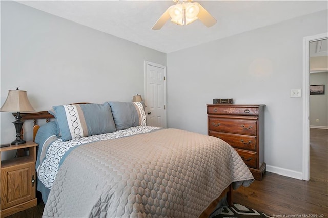 bedroom featuring ceiling fan and dark wood-type flooring