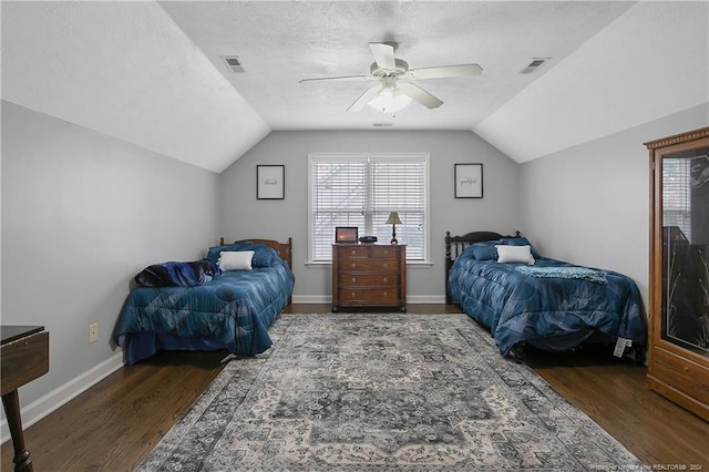 bedroom with hardwood / wood-style flooring, vaulted ceiling, and ceiling fan