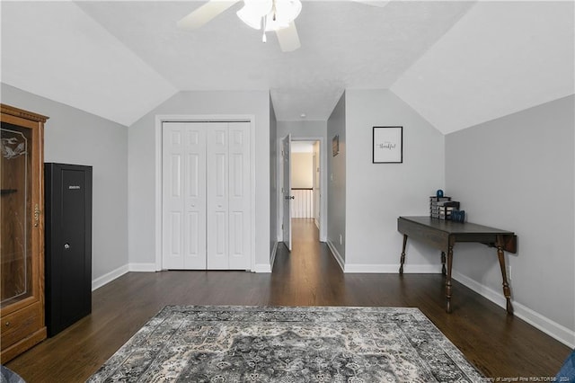 interior space featuring dark hardwood / wood-style floors and vaulted ceiling