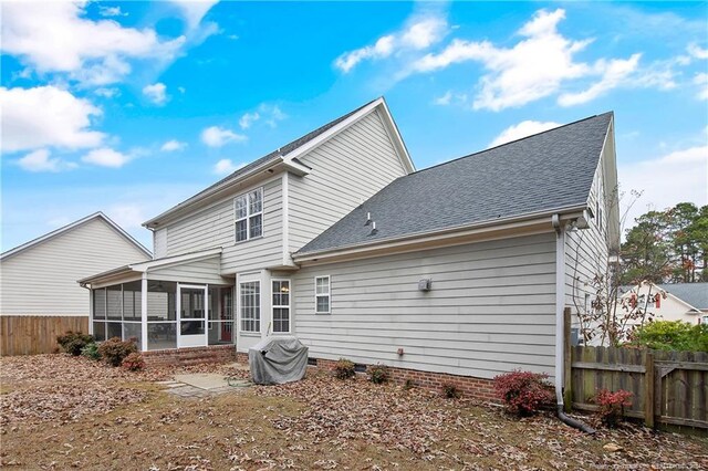 rear view of house with a sunroom