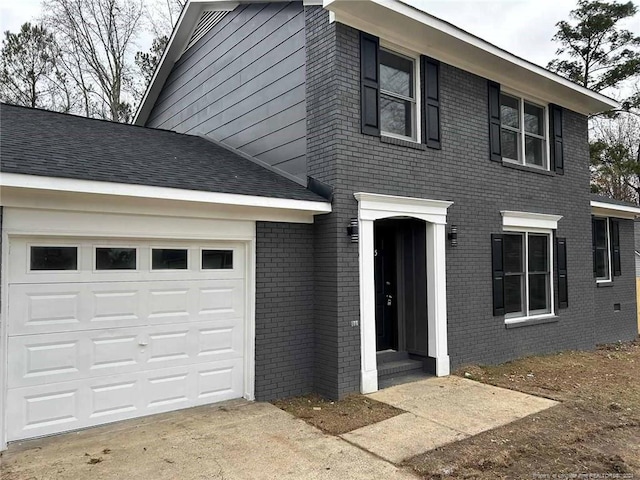 view of front of home with a garage