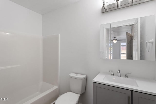 full bathroom with bathtub / shower combination, vanity, toilet, and ceiling fan