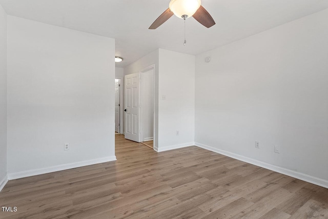 empty room featuring ceiling fan and light wood-type flooring