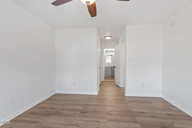 unfurnished room with ceiling fan and light hardwood / wood-style flooring