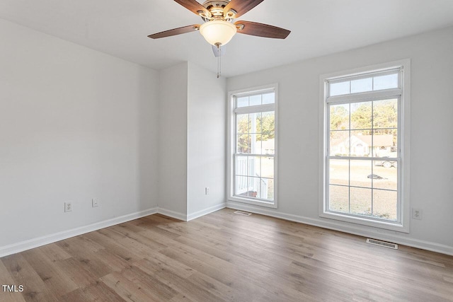 spare room with ceiling fan and light hardwood / wood-style flooring