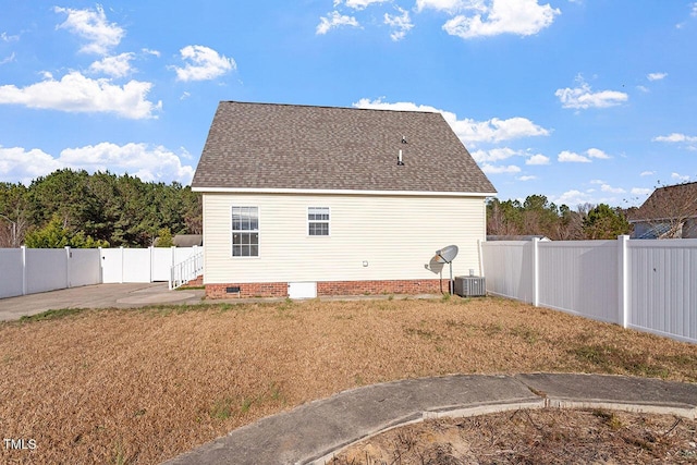 view of side of home featuring central AC unit