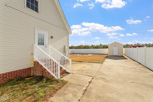 view of patio / terrace featuring a shed