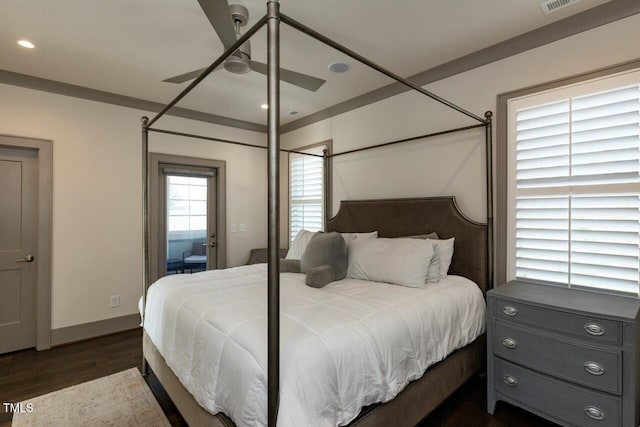 bedroom with ceiling fan and dark hardwood / wood-style flooring