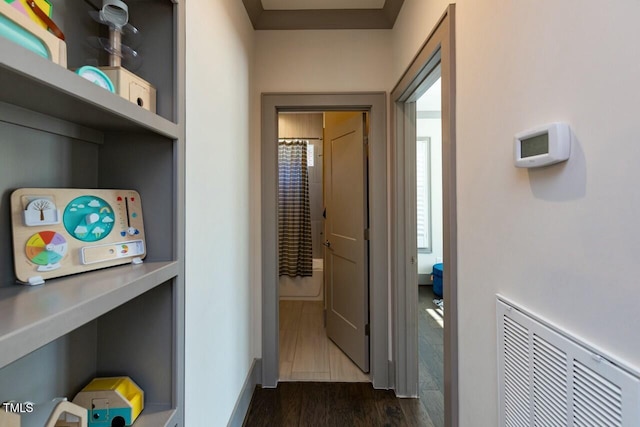 hallway featuring dark wood-type flooring