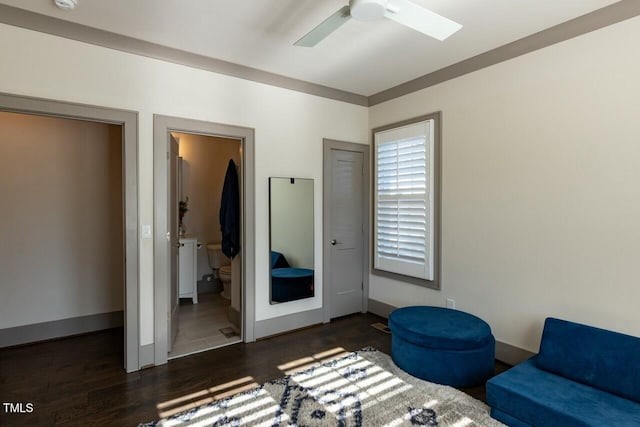 sitting room featuring ceiling fan and dark hardwood / wood-style floors