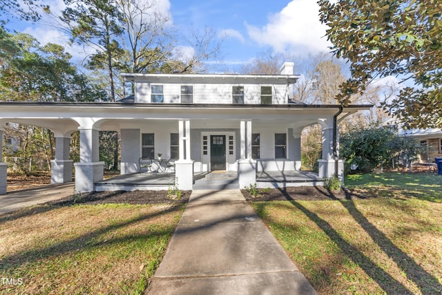 view of front of home featuring a porch and a front lawn