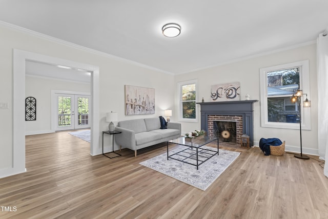 living room featuring a fireplace, hardwood / wood-style flooring, and ornamental molding