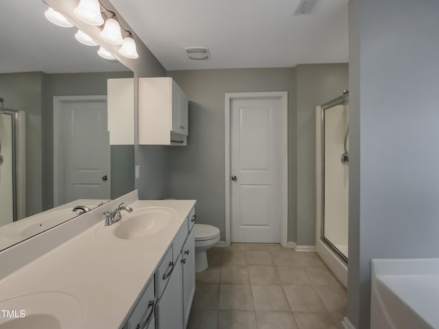 bathroom with tile patterned flooring, vanity, and shower with separate bathtub