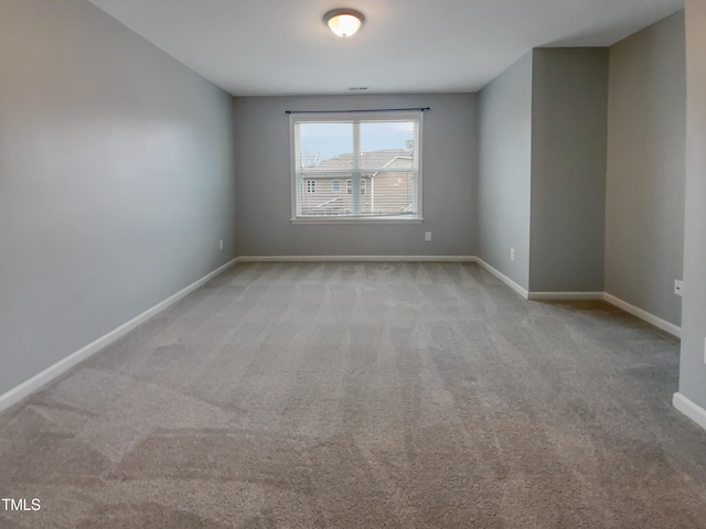 empty room featuring light colored carpet