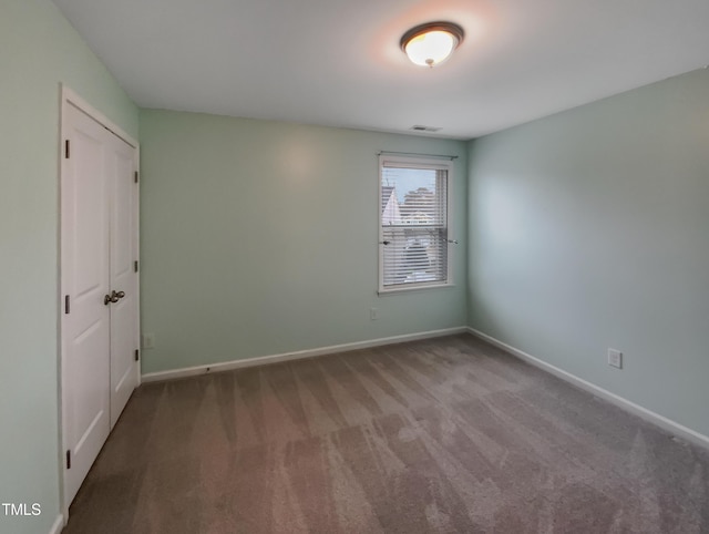 unfurnished room with carpet