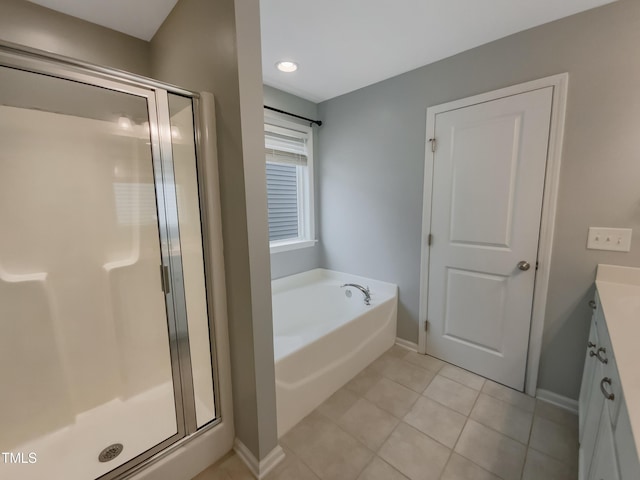 bathroom with tile patterned floors, vanity, and plus walk in shower