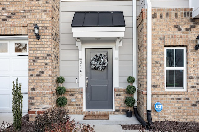 entrance to property featuring a garage