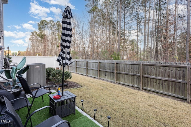 view of yard featuring central AC unit